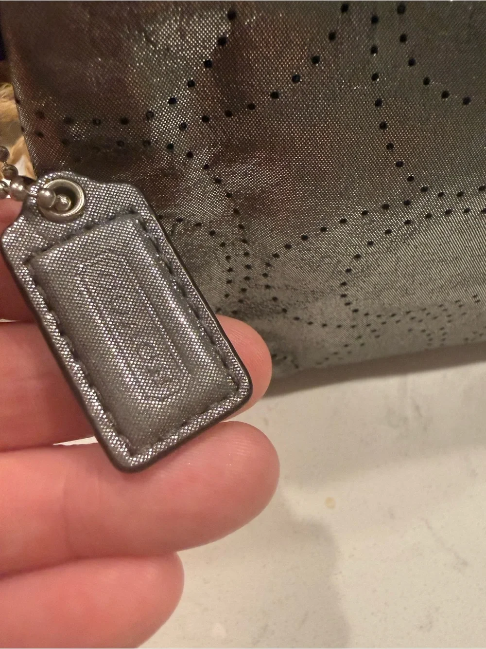 Coach Metallic Pewter Perforated Wristlet